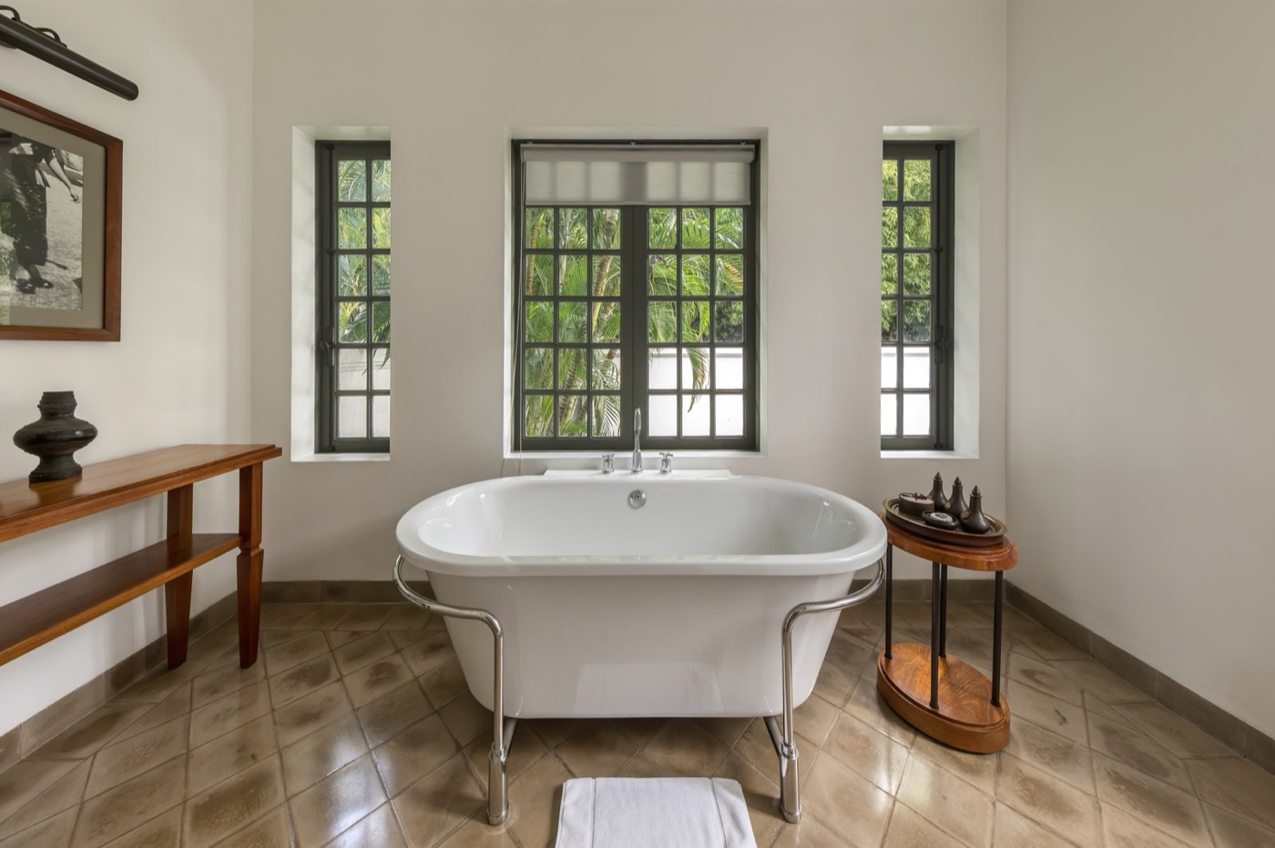 A standard bath holds about eighty litres when it is full. Most of the argument is decided by that number.