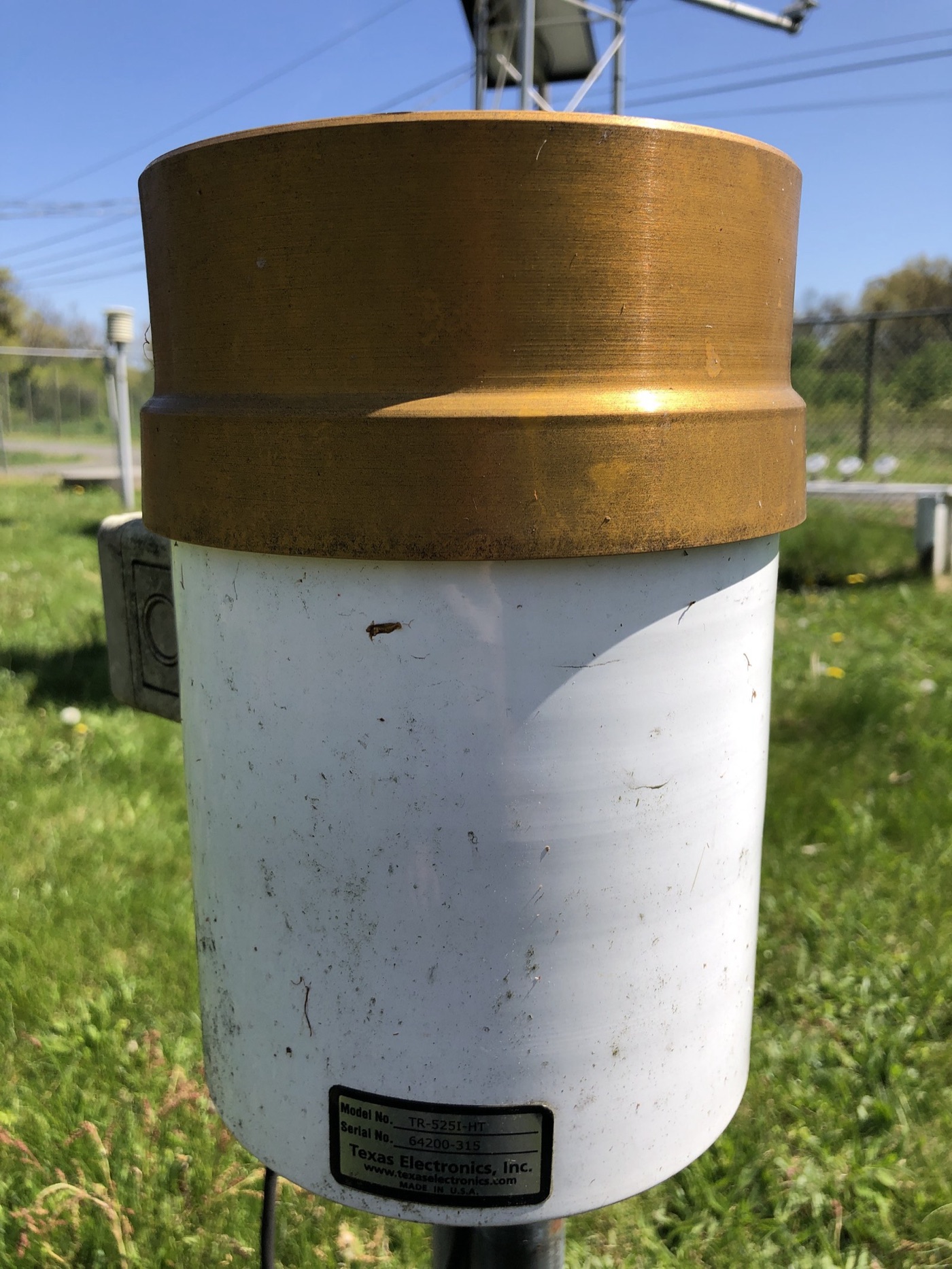 A rain gauge. What it collects is the cleanest water most people will ever see, and it has not yet met a roof.