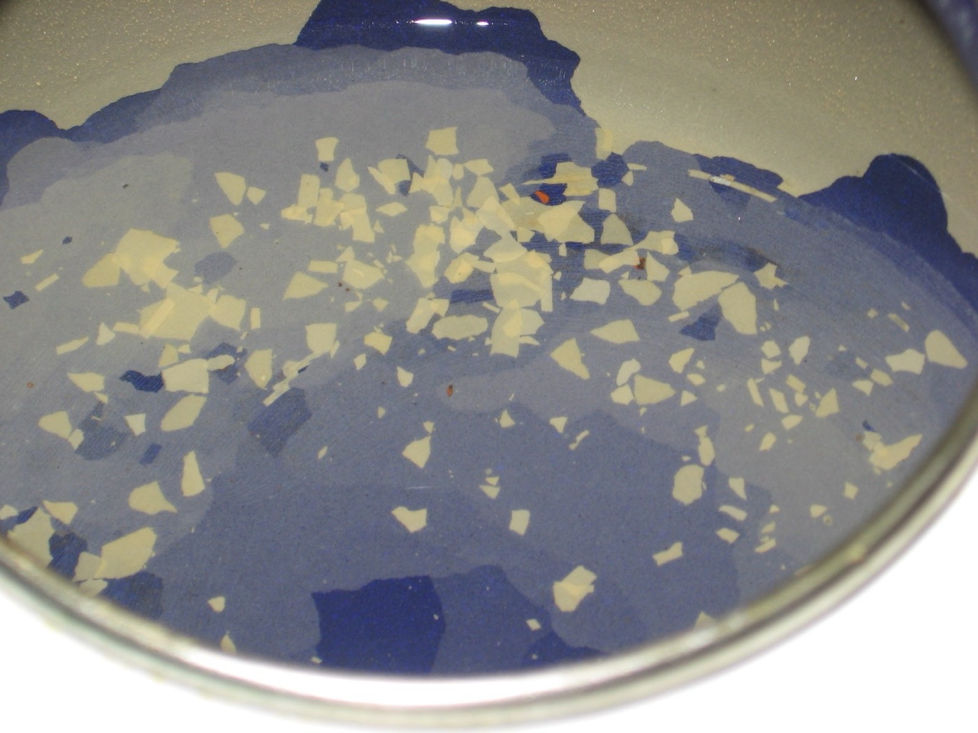 Flakes of scale in a pan. On a membrane, the same crystals form on the surface that lets the water through.