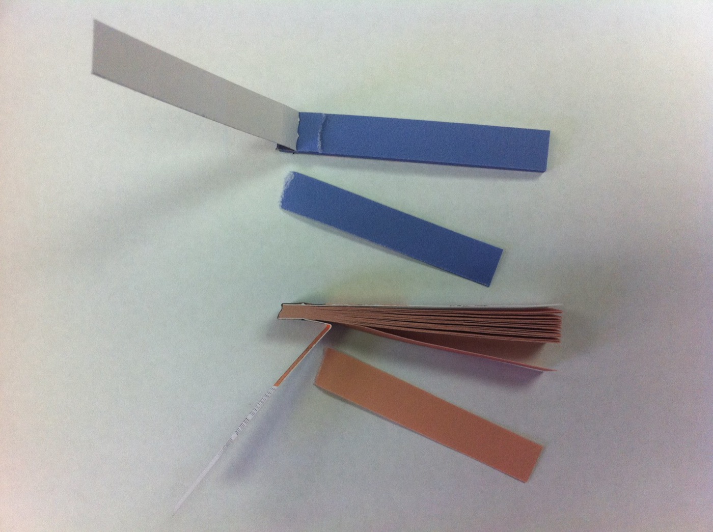 Litmus strips. Red for acid, blue for alkaline, and the oldest pH test there is.