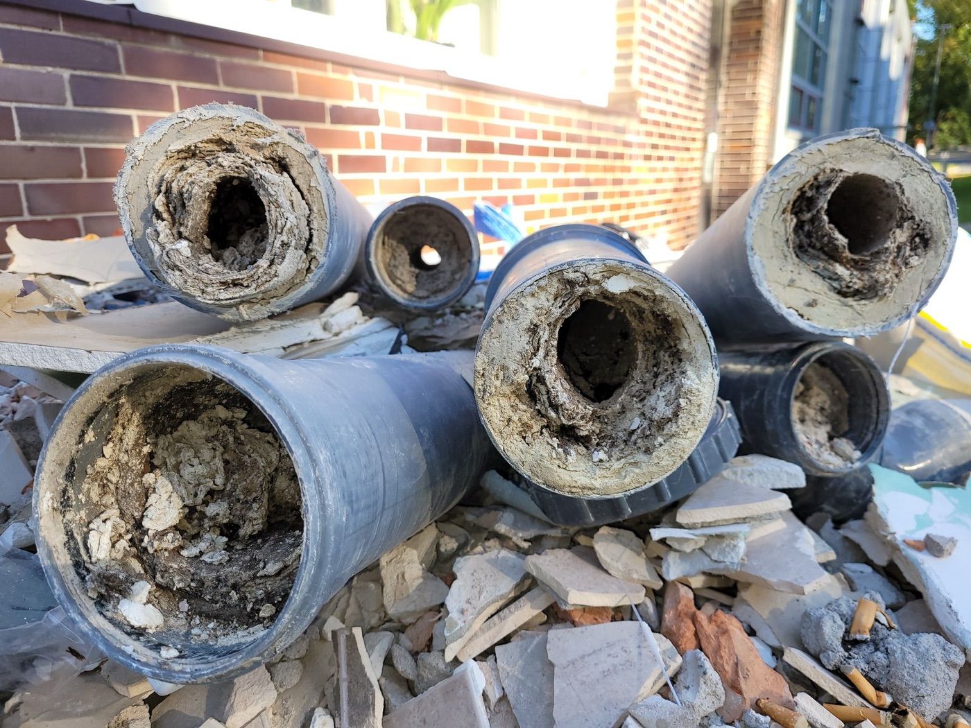 Pipes choked with struvite, a phosphate mineral that grows inside sewage works. Some plants now grow it on purpose and sell it.