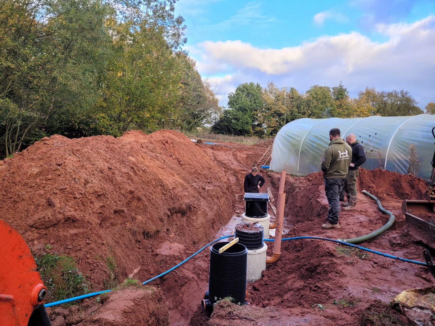 A tank going into the ground. Three to four cubic metres, two chambers, no pump and no power.