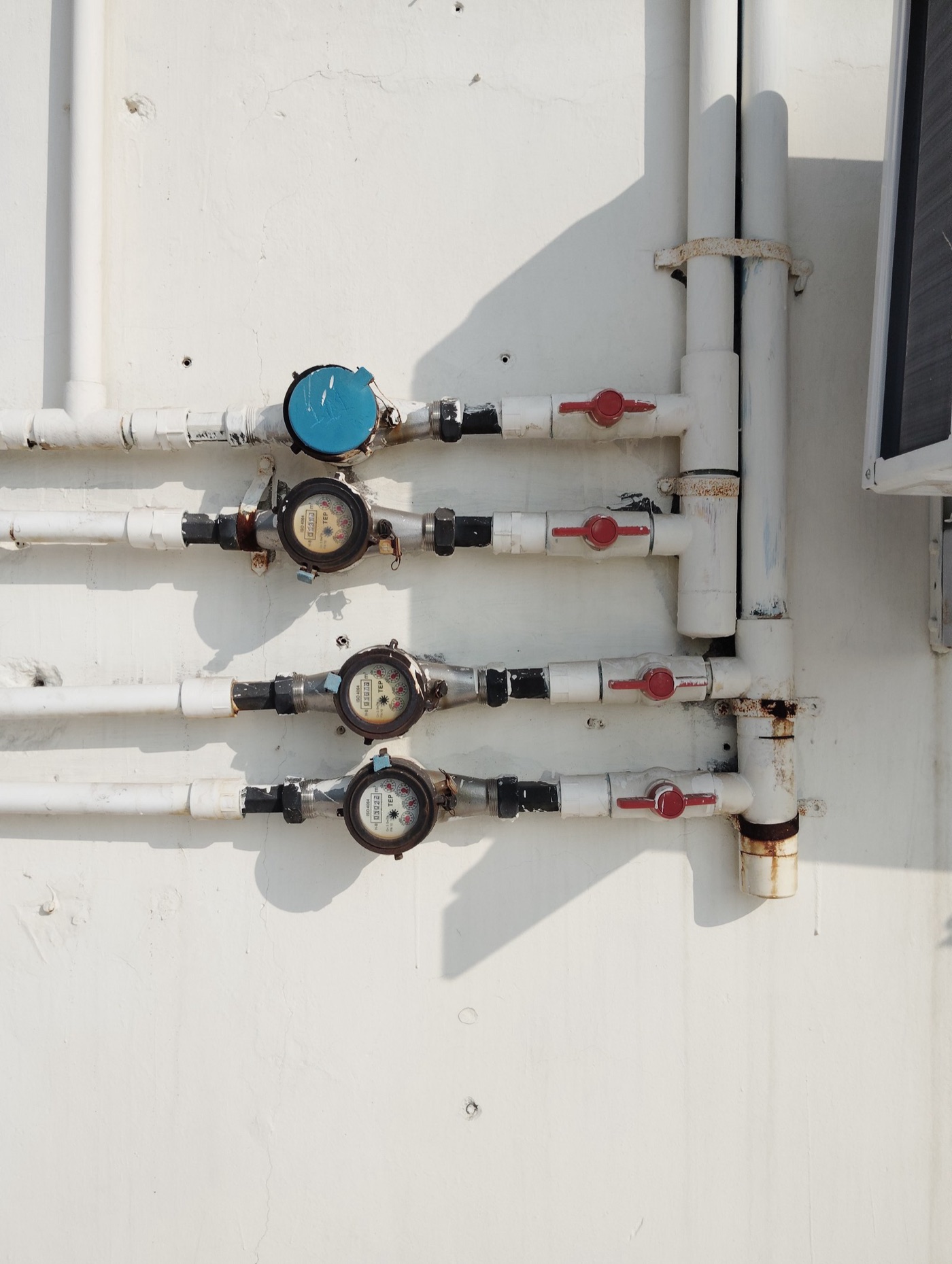 Meters on a block in India. The utilities that turned their losses round began by metering everything.