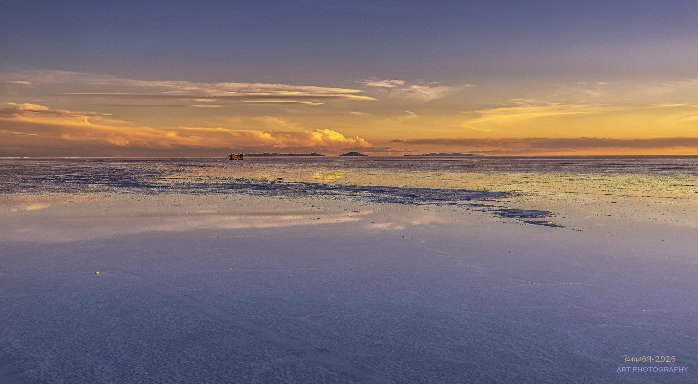 A salar at dusk. Under the crust is a brine aquifer, and around its edge the fresh water the villages depend on.