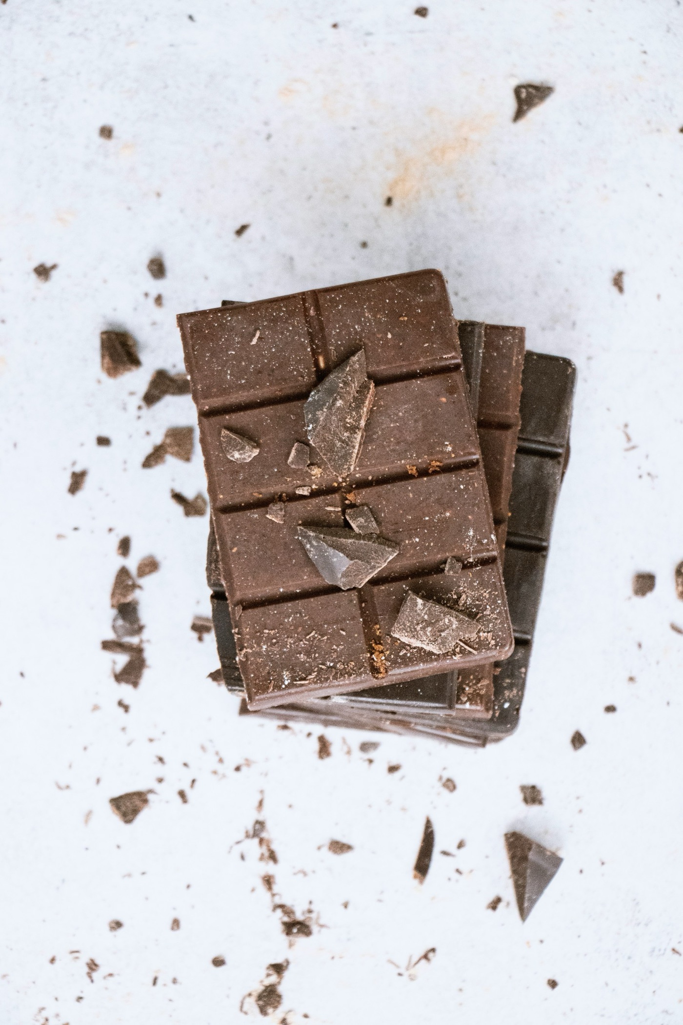 Cocoa beans, nibs and the bar they become. Most of the tree's year goes into the shell and the pulp, which are thrown away.