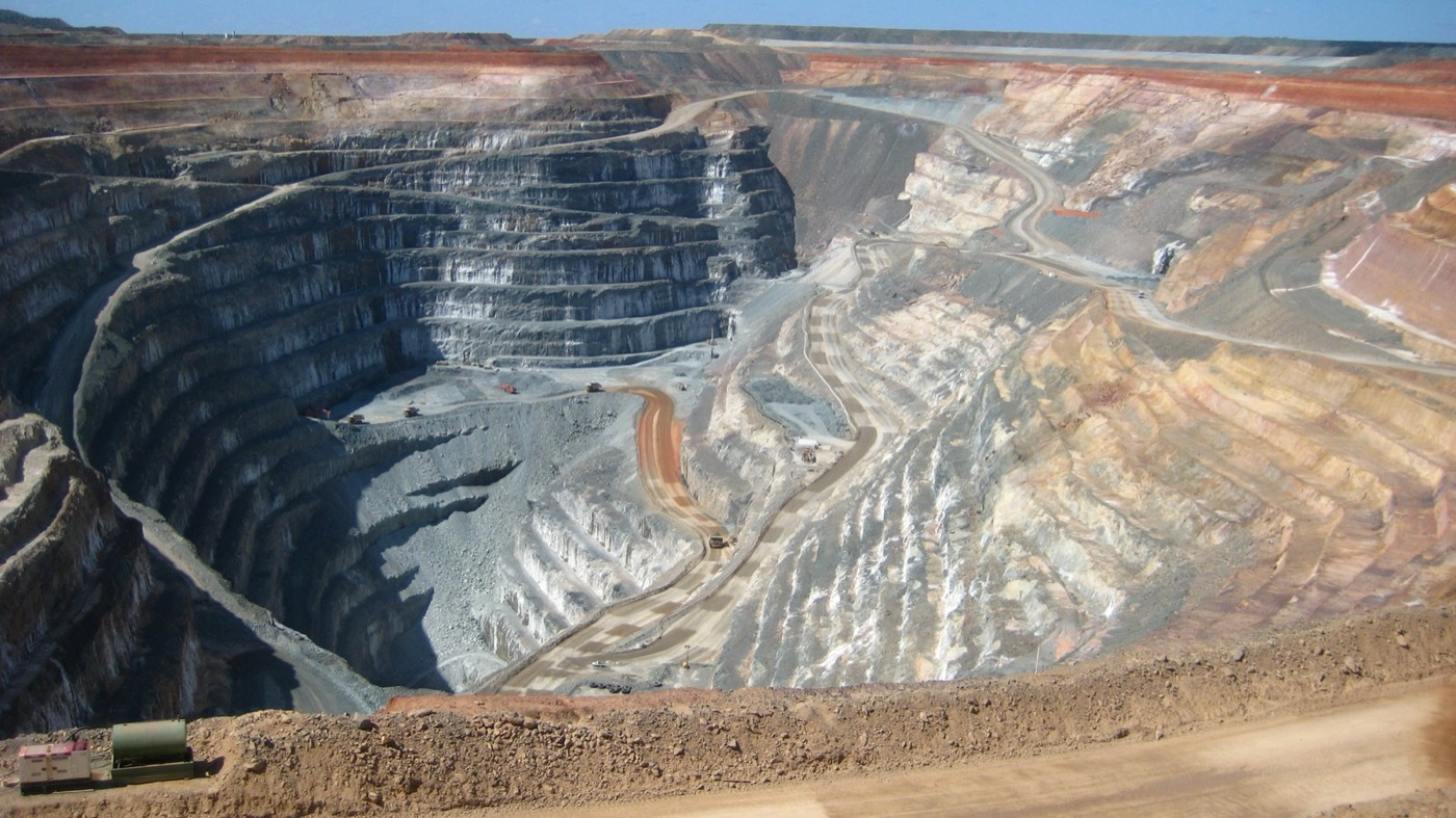 An open pit gold mine in Western Australia. A gram or two of gold in every tonne of this rock.