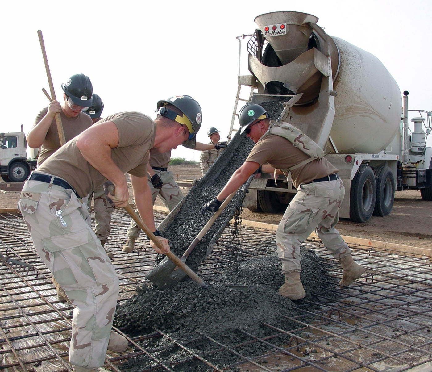 Placing a slab. The water in the mix stays in the concrete; the water that cures it goes into the air.