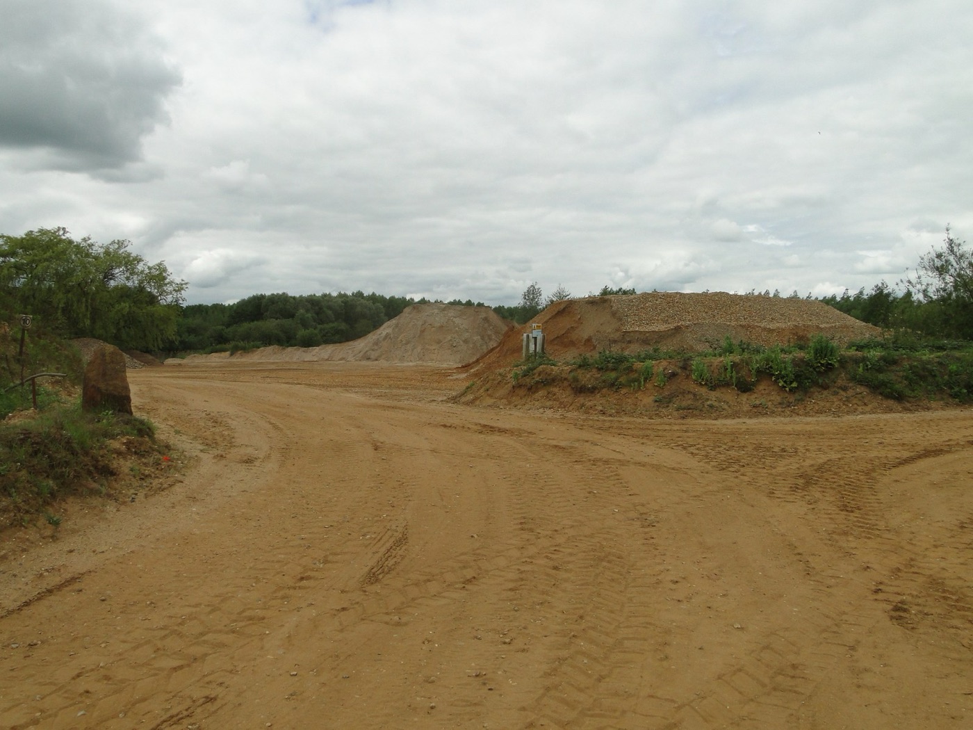 Stockpiles at an aggregate quarry. Washing the sand and gravel is often the largest share of concrete's water.