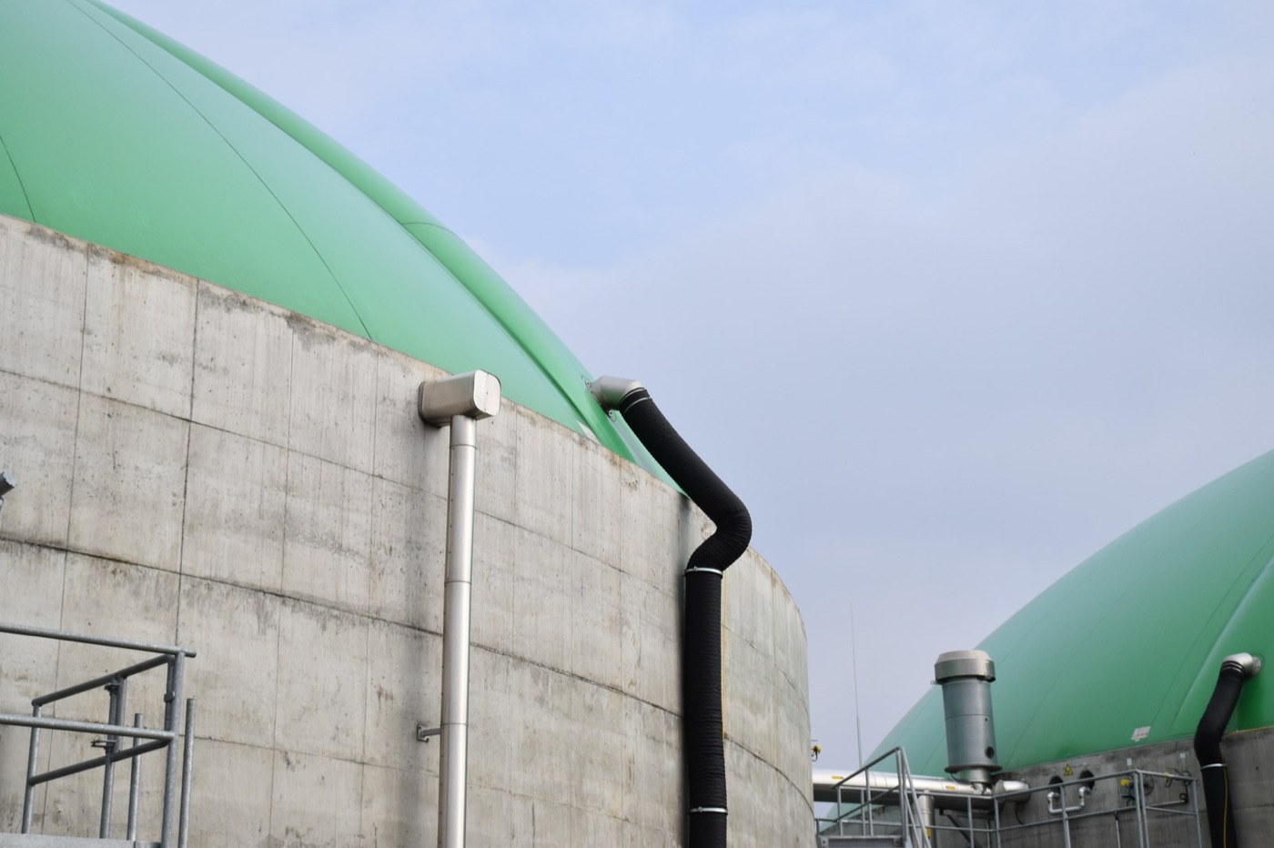 Biogas domes at a plant. The sugars and milk in a food factory's effluent become the gas that heats it.