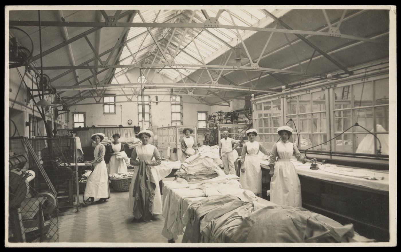Nurses in a hospital laundry, early twentieth century. The linen of a large hospital is still washed on site at twenty to thirty litres a kilogram.