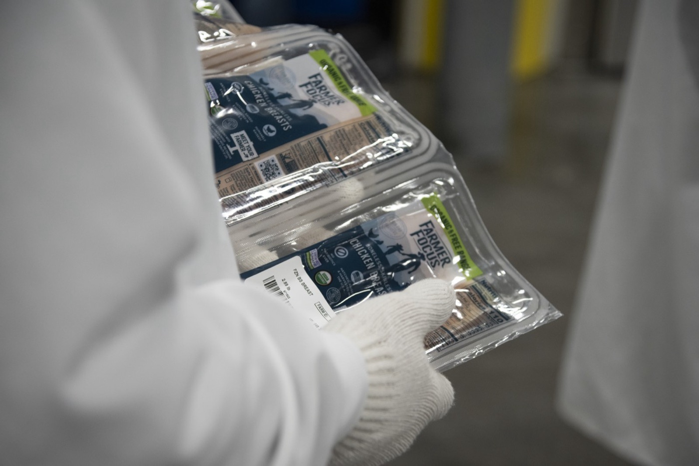 The packet carries the farm's thousands of litres, the plant's ten, and in some countries a few percent of water added at the chill tank.