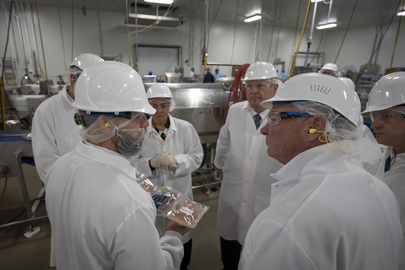 Inside a meat plant. Everything that touches meat is washed, continuously, in hot water with chlorine or detergent.
