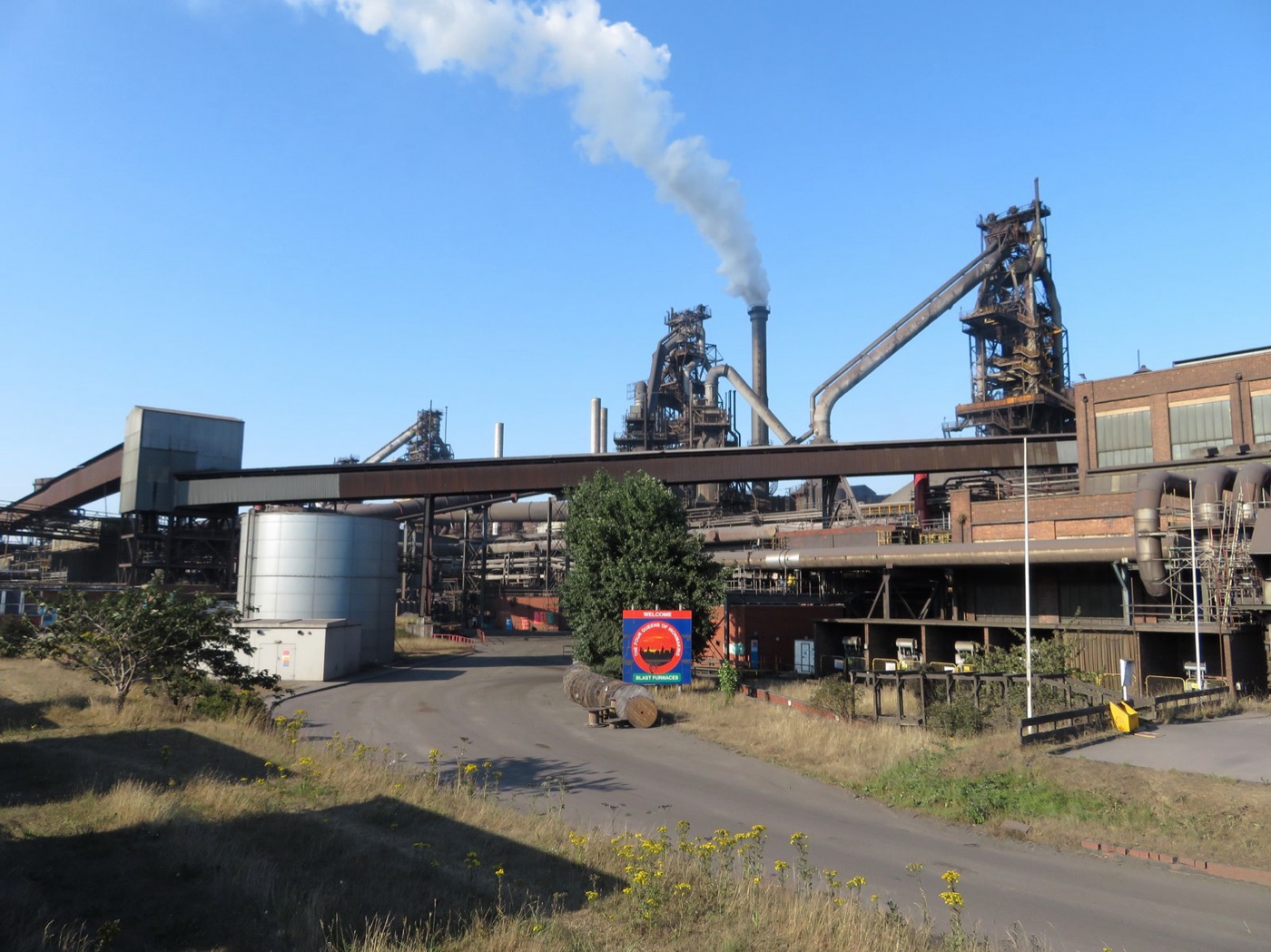 A blast furnace with its plume. Every part of it that touches the metal is cooled by water.