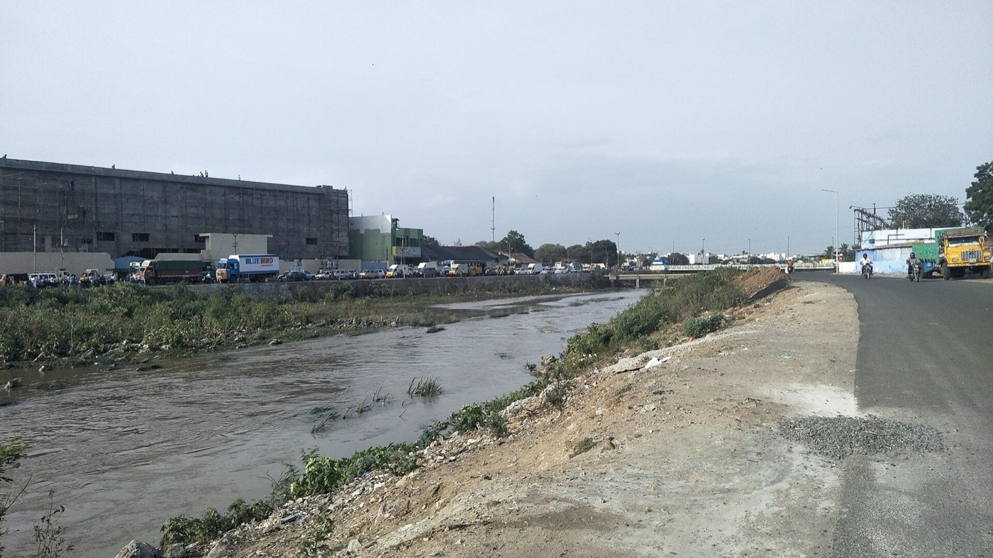The Noyyal river below Tirupur. For decades it carried the town's dye water, and the 2011 order was written for this stretch.