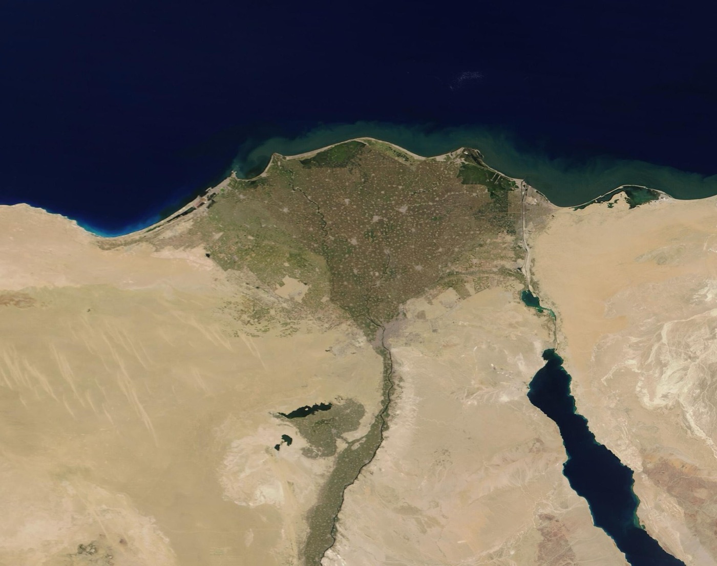 Egypt from space: the green thread of the valley and the fan of the delta, and desert on either side.
