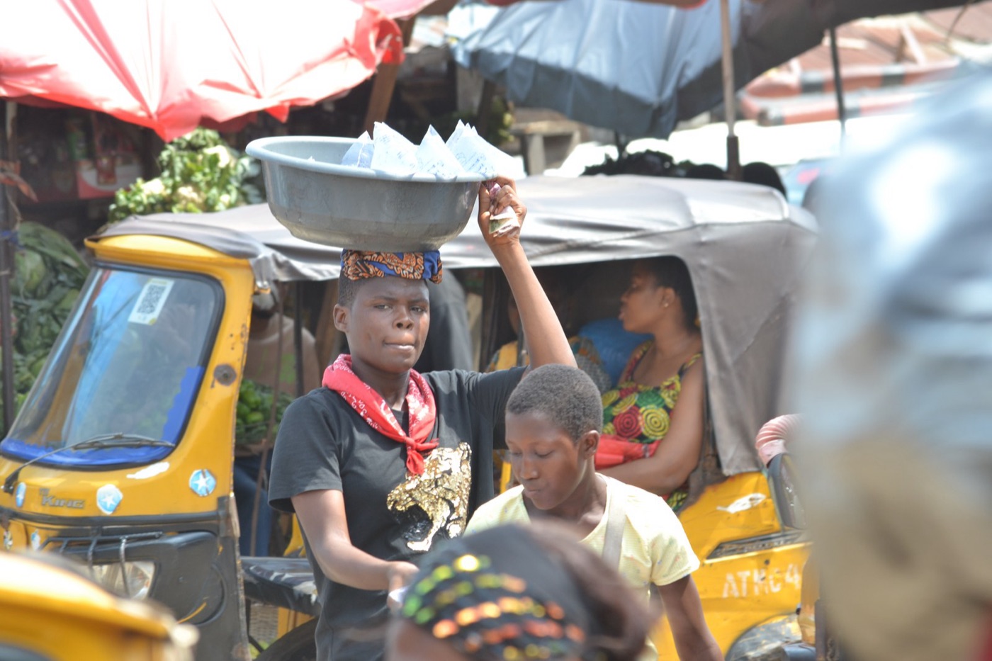 A sachet water seller on a Nigerian street. For millions in Lagos, the half litre bag is the tap.