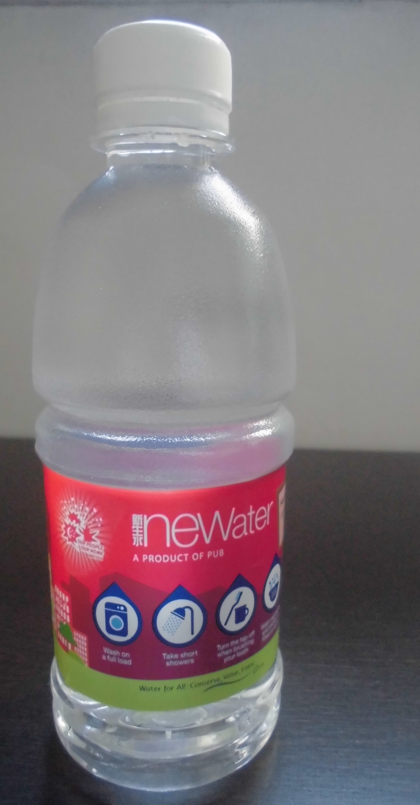 A bottle of NEWater handed out at the National Day Parade in 2014. The product still goes to the crowd, in bottles, every year.