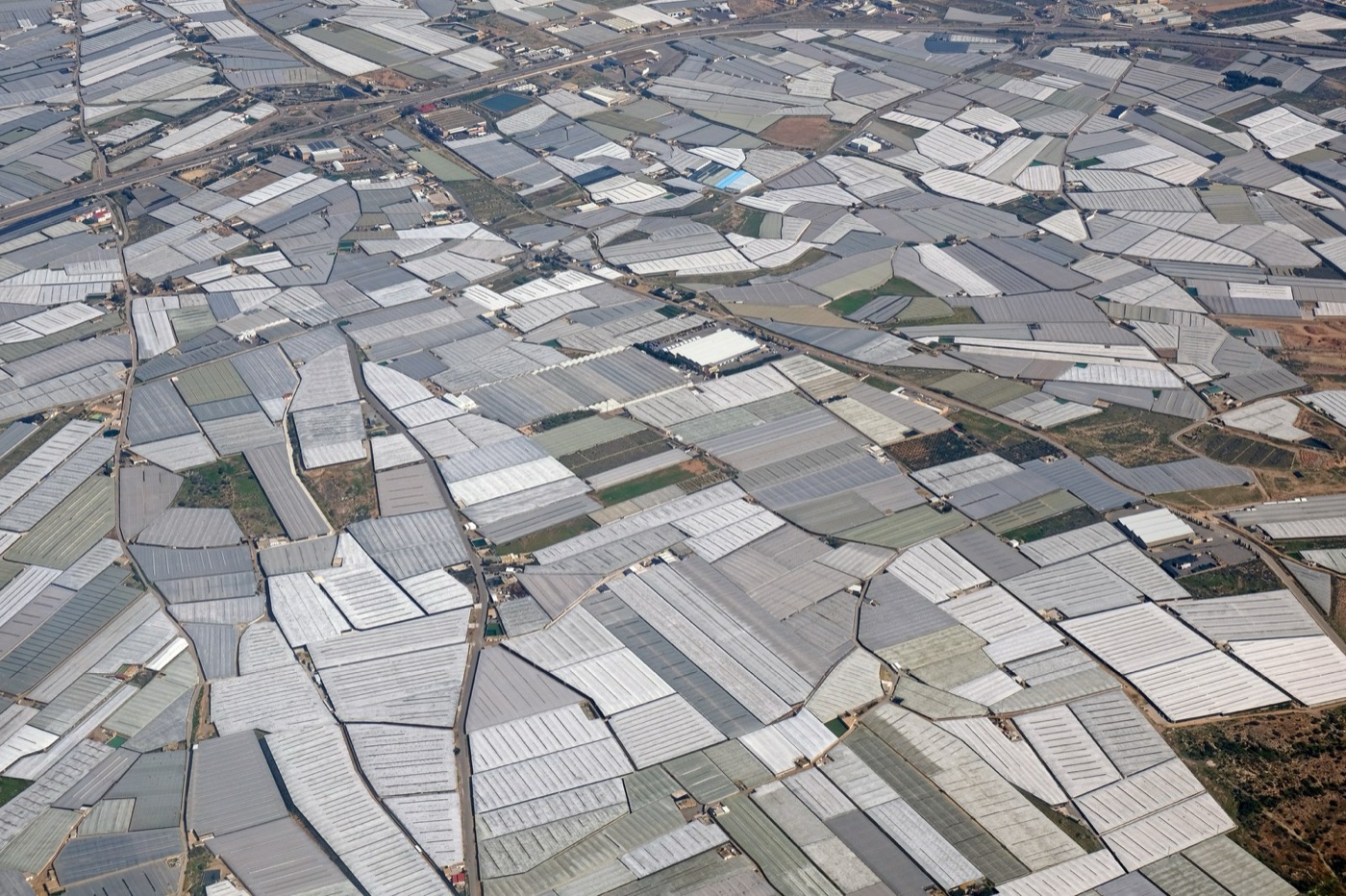 The plastic greenhouses of Almería from the air, on one of the driest coasts in Europe.